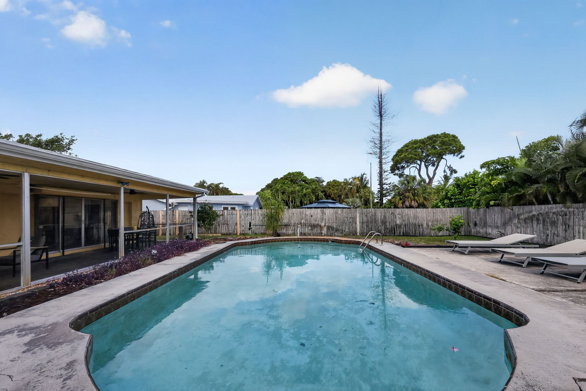 Pool and back exterior view 3 at 159 SE 26th Ave, Boynton Beach