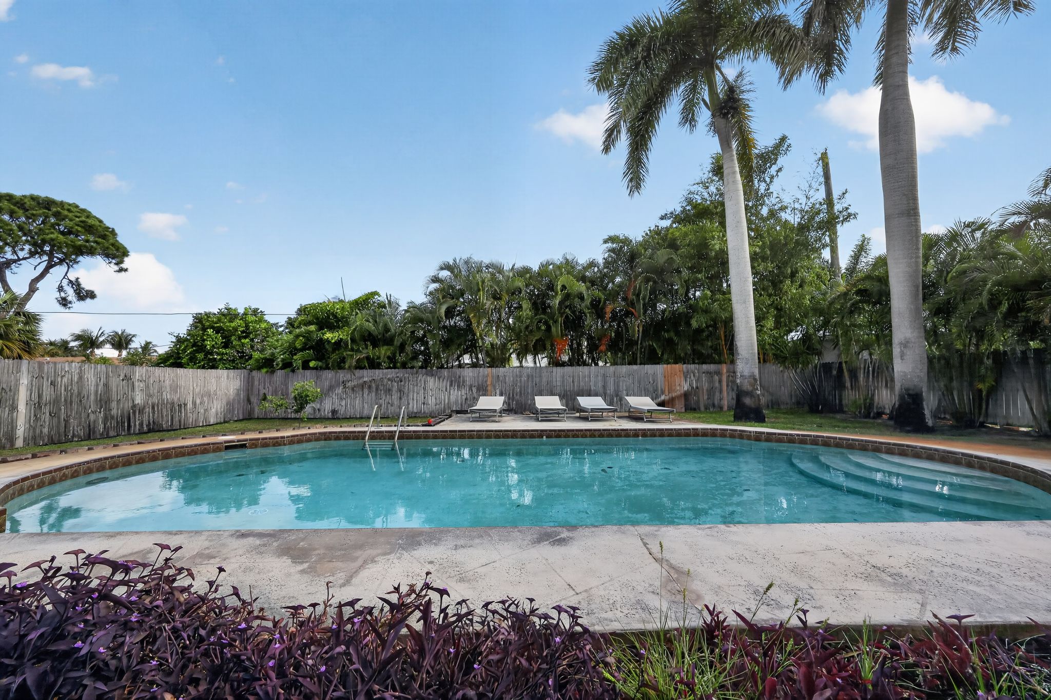Pool and back exterior view 4 at 159 SE 26th Ave, Boynton Beach