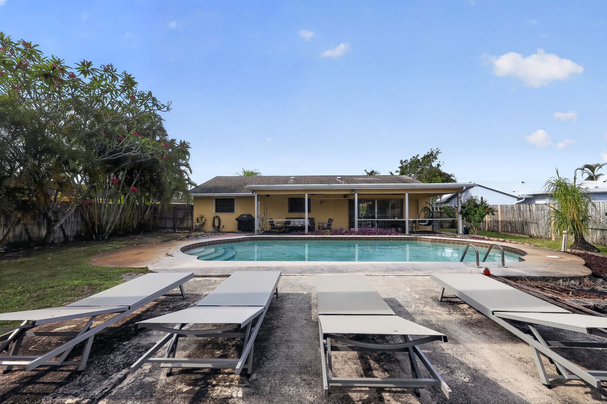 Pool and back exterior view 7 at 159 SE 26th Ave, Boynton Beach
