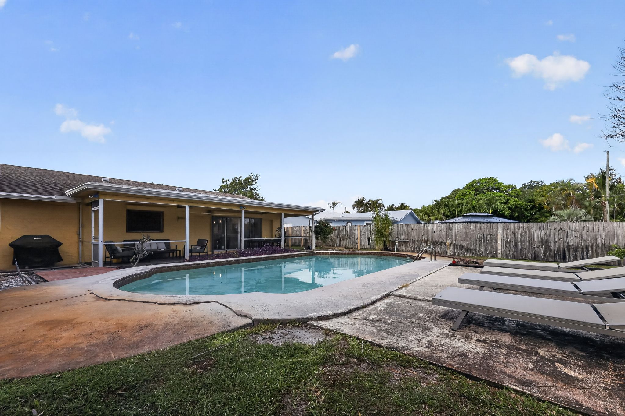 Pool and back exterior view 8 at 159 SE 26th Ave, Boynton Beach